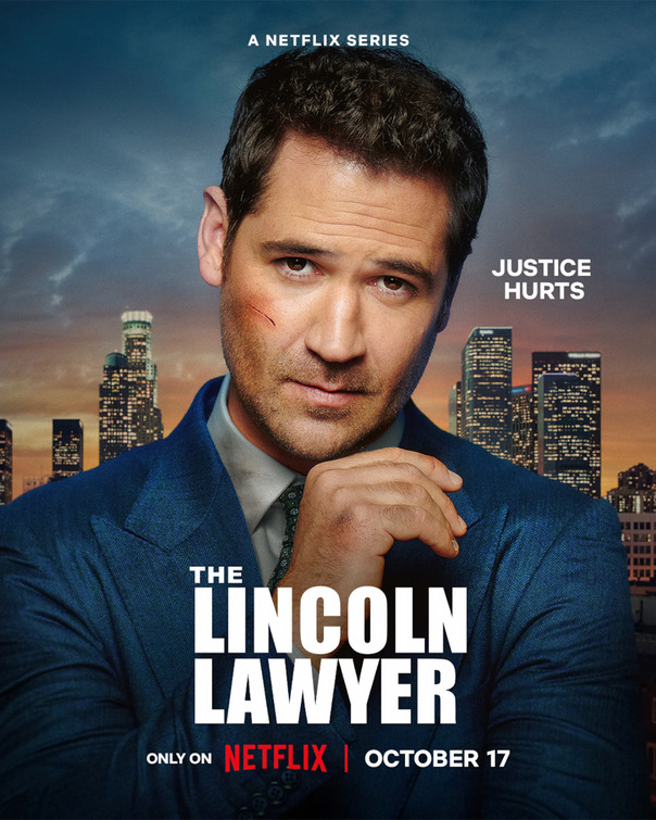Promotional poster for the Netflix series The Lincoln Lawyer featuring a man in a blue suit with a cut on his face, standing in front of the Los Angeles skyline. The text reads “Justice Hurts,” “The Lincoln Lawyer,” “Only on Netflix,” and “October 17.”