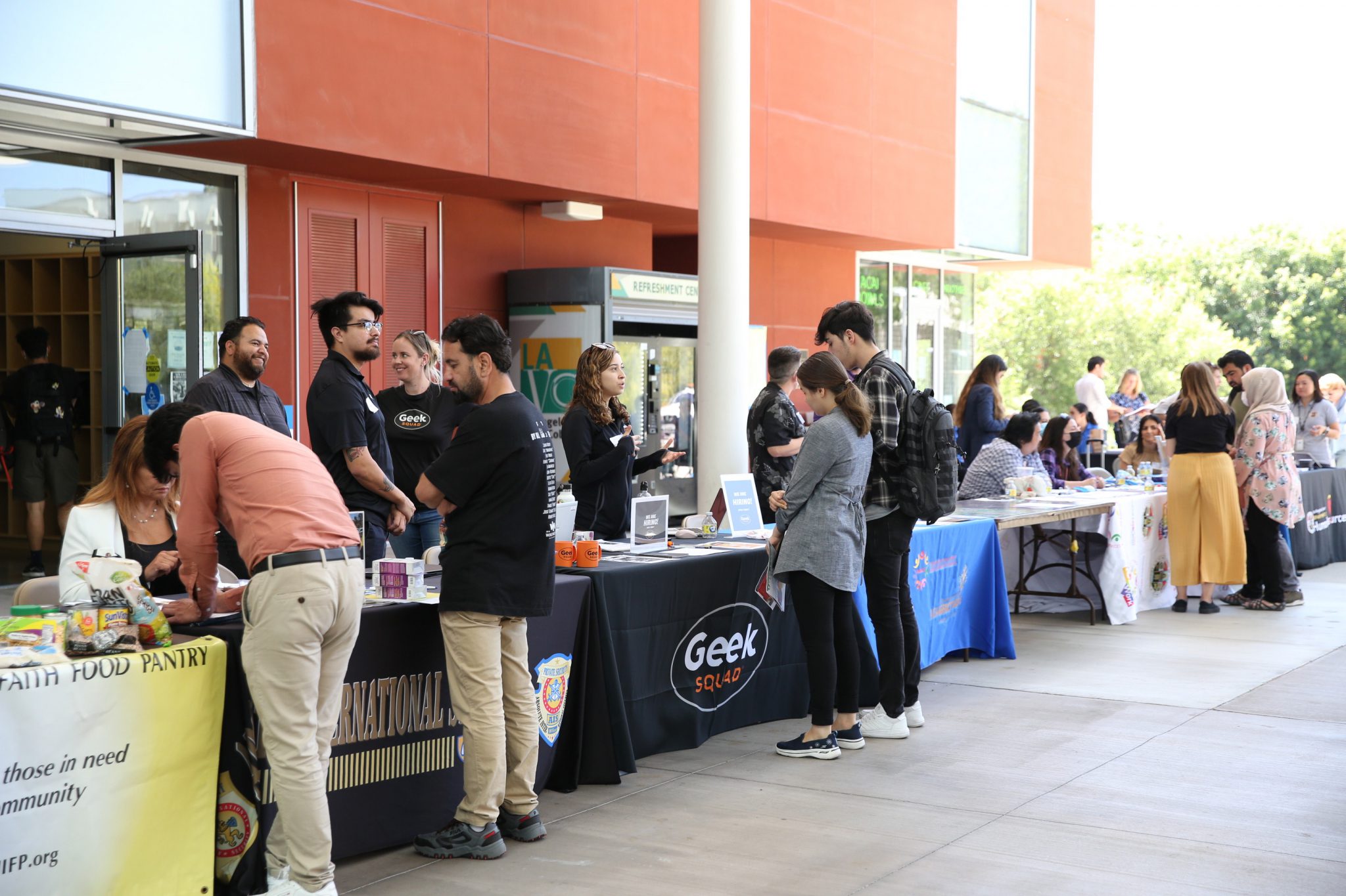 Local organizations connect with community members at an outdoor outreach and resource event.