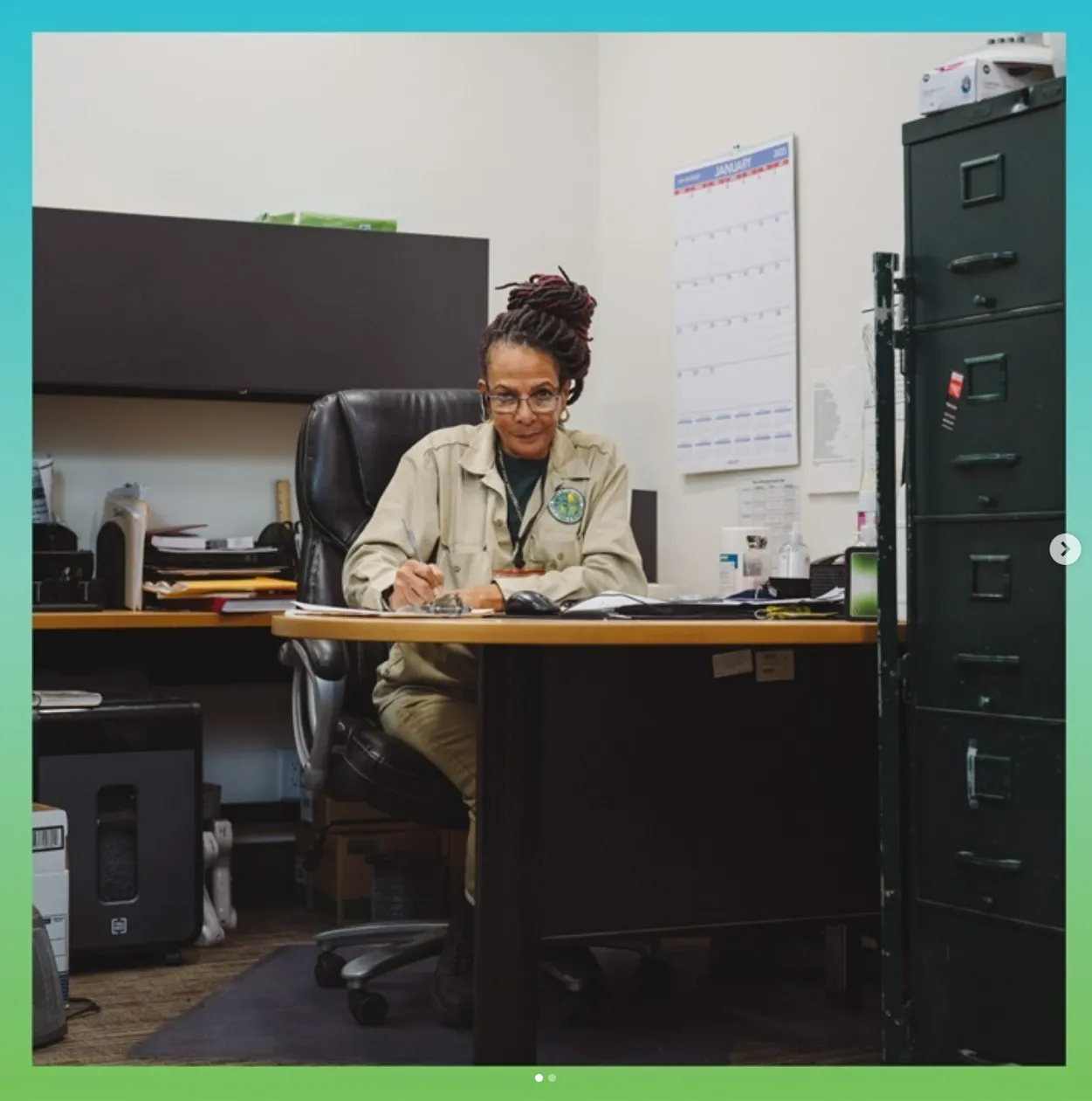 Woman working at a desk.