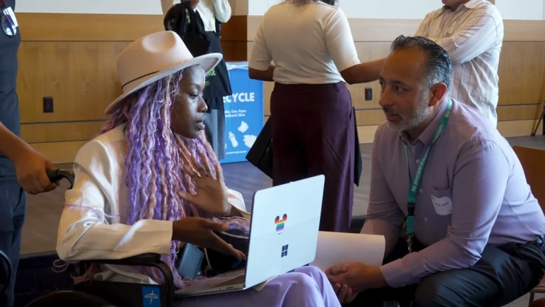 People talking individually at a Fair Chance event.