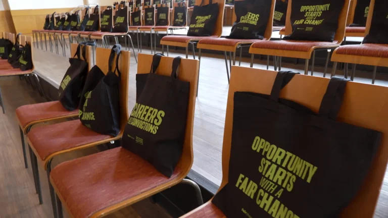 Gift bags on chairs.